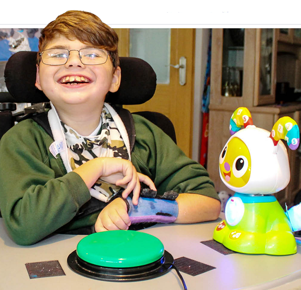child using switch with a toy 